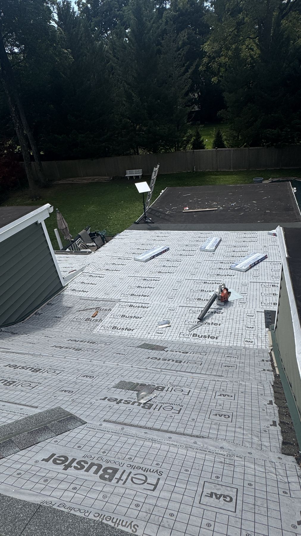 North Jersey roof dried in with GAF FeltBuster synthetic underlayment and cap nails after emergency tear-off