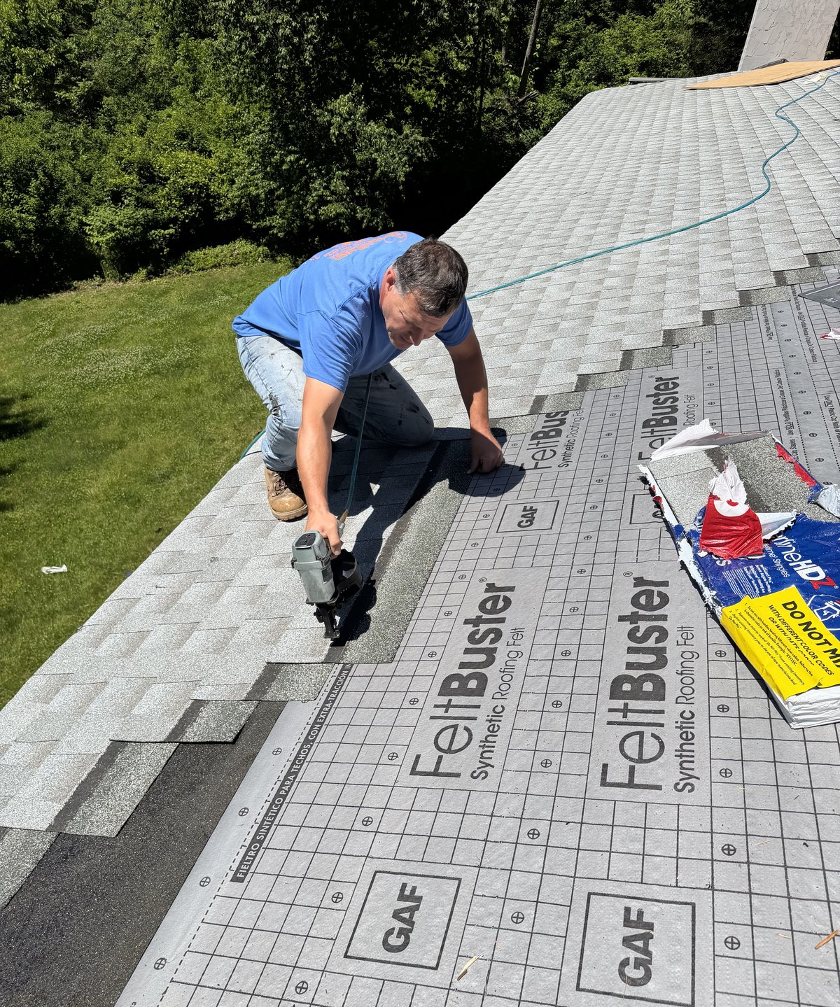 Sammy installing GAF Timberline shingles over synthetic underlayment on a roof in Basking Ridge NJ